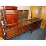 A STAG MINSTREL DRESSING TABLE, BEDSIDE CABINET AND SIX DRAWER CHEST (3)