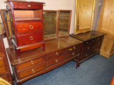 A STAG MINSTREL DRESSING TABLE, BEDSIDE CABINET AND SIX DRAWER CHEST (3)