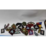 A SELECTION OF MILITARY CLOTH BADGES