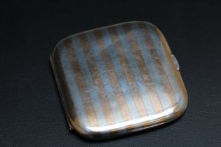 SAMPSON MORDAN & CO - A HALLMARKED SILVER CIGARETTE CASE, decorated with what appears to be rose