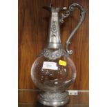 A PEWTER AND GLASS CLARET JUG