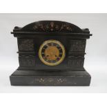 A LATE 19TH CENTURY BLACK SLATE MANTLE CLOCK, the case having an arched top with cherub panelled