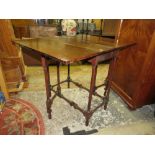 A SMALL MAHOGANY DROPLEAF TABLE WITH SPINDLE LEGS