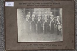 AN ANTIQUE MOUNTED PHOTOGRAPH OF 2ND BATTALION THE SOUTH STAFFORDSHIRE REGIMENT DECEMBER 22ND 1933