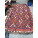 A LARGE WOOLLEN RUG 300 cm x 180 cm