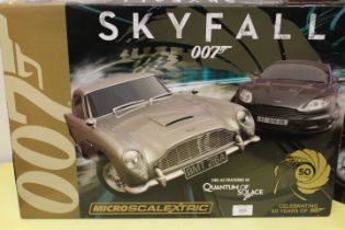 A BOXED MICRO SCALEXTRIC SKYFALL 007 QUANTUM OF SOLACE CONTENTS UNCHECKED