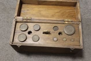A WOODEN CASED SET OF SCALES AND WEIGHTS UNCHECKED