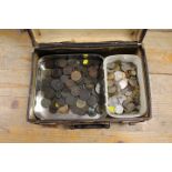 A SMALL LEATHER SUITCASE CONTAINING COLLECTABLE COINAGE