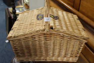 A WICKER DOUBLE SIDED PICNIC HAMPER AND CONTENTS