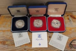 THREE SILVER PROOF CROWNS