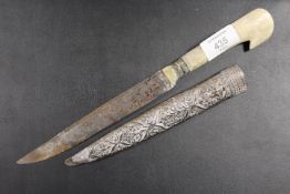 AN ANTIQUE DAGGER WITH WHITE METAL CASE A/F