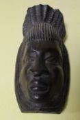 A VINTAGE CARVED TRIBAL WALL MASK