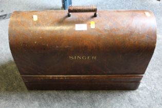 A CASED SINGER SEWING MACHINE - NO KEY