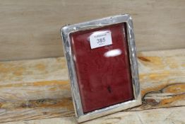 AN ANTIQUE HALLMARKED SILVER PICTURE FRAME