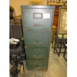 A VINTAGE METAL FOUR DRAWER FILING CABINET