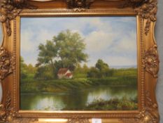 A GILT FRAMED OIL ON CANVAS OF A RIVERSIDE WATERMILL SIGNED LOWER RIGHT "F TARBY "