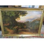 A GILT FRAMED OIL ON CANVAS OF A HILLSIDE RIVER SCENE WITH A CASTLE IN THE DISTANCE