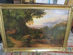 A GILT FRAMED OIL ON CANVAS OF A HILLSIDE RIVER SCENE WITH A CASTLE IN THE DISTANCE