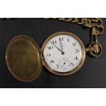 A GOLD PLATED WALTHAM FOUR HUNTER POCKET WATCH ON A GOLD EFFECT CHAIN