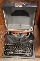 A CASED PORTABLE "THE GOOD COMPANION" IMPERIAL TYPE WRITER