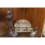 A VINTAGE PIPE RACK TOGETHER WITH TWO EGYPTIAN STYLE FIGURES (3)