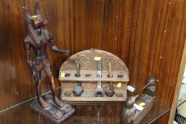 A VINTAGE PIPE RACK TOGETHER WITH TWO EGYPTIAN STYLE FIGURES (3)