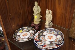 A PAIR OF ORIENTAL SOAP STONE CARVED FIGURES TOGETHER WITH DECORATIVE PLATES