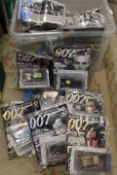 A BOX OF MOSTLY SEALED JAMES BOND CAR COLLECTION MODELS