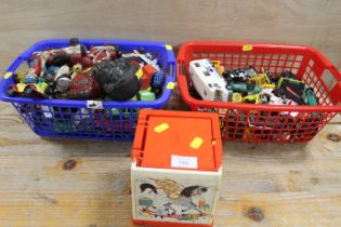 TWO BASKETS OF VINTAGE TOY CARS ETC TOGETHER WITH A FISHER PRICE JACK IN THE BOX