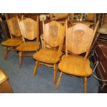 A CARVED OAK SET OF FOUR HERALDIC LION CHAIRS WITH DINING TABLE