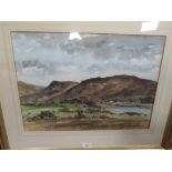 A FRAMED AND GLAZED WATERCOLOUR OF HILLSIDE LAKE SCENE SIGNED LOWER RIGHT BELL FOSTER