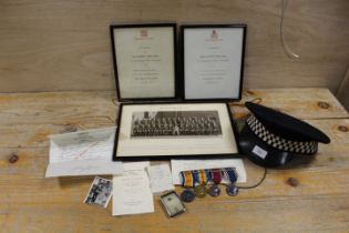 A COLLECTION OF MILITARY AND POLICE MEMORABILIA TO INCLUDE A BAR CONTAINING FIRST WORLD WAR AND
