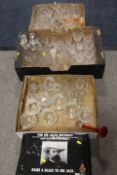 THREE TRAYS OF ASSORTED GLASSWARE TO INCLUDE DECANTERS, A BOX JACK DANIELS GLASSES DRINKING SET