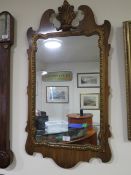 A GEORGIAN STYLE WALL MIRROR TOGETHER WITH A WALNUT AND GILT FRAMED EXAMPLE (2)