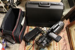 A PANASONIC M7 VIDEO CAMERA AND ACCESSORIES