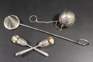 A SILVER DIFFUSER STAMPED STERLING, TWO UNUSUAL PIERCED SCOOPS STAMPED STERLING, AND A CANDLE