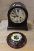 A VINTAGE DOMED MANTLE CLOCK TOGETHER WITH A SMALL WALL MOUNTED BAROMETER