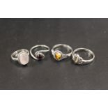 A COLLECTION OF 4 SILVER GEMSTONE DRESS RINGS TO INCLUDE OPAL, ONYX ETC