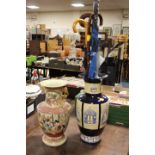 TWO LARGE ORIENTAL STYLE VASES ONE CONTAINING UMBRELLAS AND WALKING STICKS