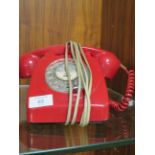 A RED DIAL TELEPHONE WITH CONNECTOR FOR THE MODERN NETWORK