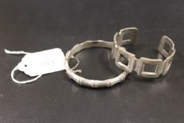 A HALLMARKED SILVER CLASP BANGLE IN A BAMBOO DESIGN, TOGETHER WITH A SMALL 925 SILVER BANGLE (2)
