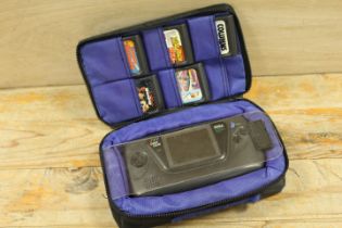 A LOGIC 3 GAME GEAR SEGA PORTABLE VIDEO GAME SYSTEM AND FIVE GAMES