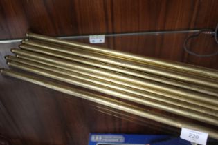 A COLLECTION OF VINTAGE BRASS STAIR RODS