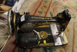 A VINTAGE ELECTRIC SEWING MACHINE (UNCHECKED)