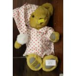 A MERRYTHOUGHT TEDDY BEAR IN SPOTTY NIGHTSHIRT AND HAT