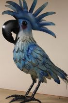 A LARGE BLUE METAL PARROT