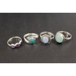 A COLLECTION OF 4 SILVER GEMSTONE DRESS RINGS TO INCLUDE OPAL, TIGERS EYE, CITRINE ETC