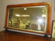 AN ANTIQUE OVERMANTLE MIRROR