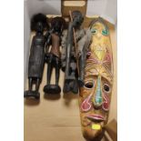 A WEST AFRICAN NIGERIAN TRIBAL ART MASK TOGETHER WITH TRIBAL ART CARVED FIGURES