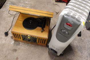 A REPRODUCTION RECORD / COMPACT DISC PLAYER AND AN OIL FILLED RADIATOR